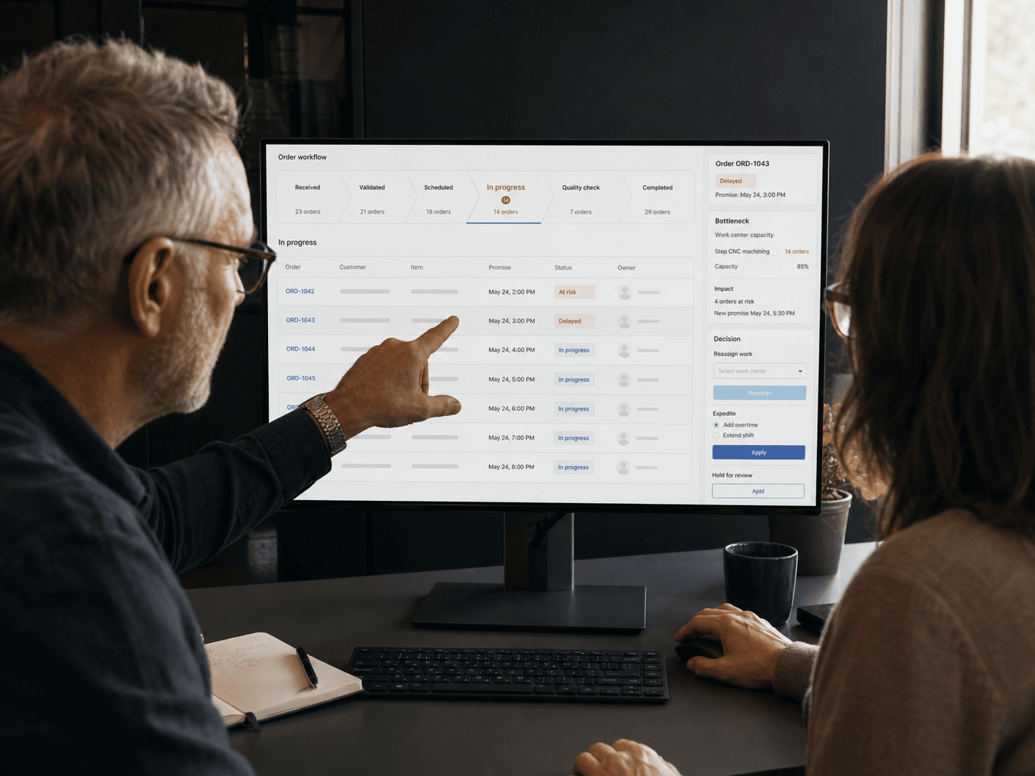 Product and operations specialists resolving a business workflow in custom software